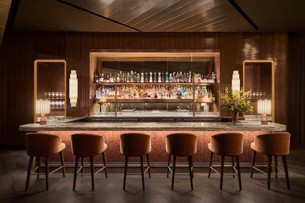 Avenue Sky Lounge bar with velvet stools and warm lighting